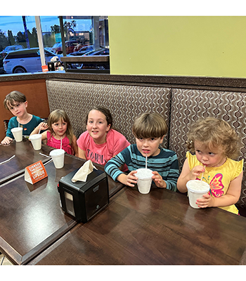 The literatal handful of Haire Children dining at McAlisters Deli - Thumbnail