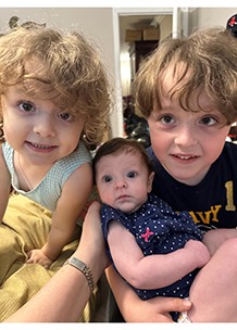 Lachlan and Sloane holding baby sister Rowan - Thumbnail